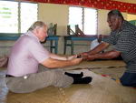 Dr. Alfred Duda accepting an offer of kava during a traditional sevusevu welcome ceremony